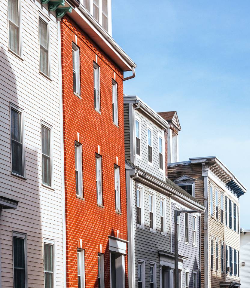 a city street with homes in the greater philadelphia area for 203k consultations and remodels